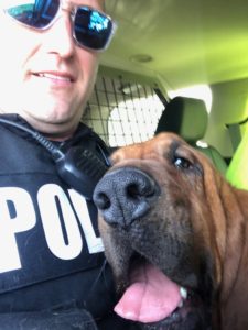 Tuscumbia PD Officer John Woodrum and bloodhound Eli