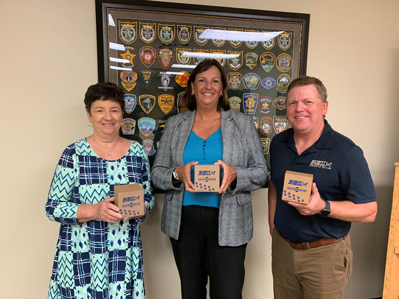 Alzheimer's Project, Debbie Moroney, Capt. Carey Love, and Scent Evidence K9 CEO, Paul Coley Bringing The Lost Home Project Scent Kits Seminole County Sheriff's Office